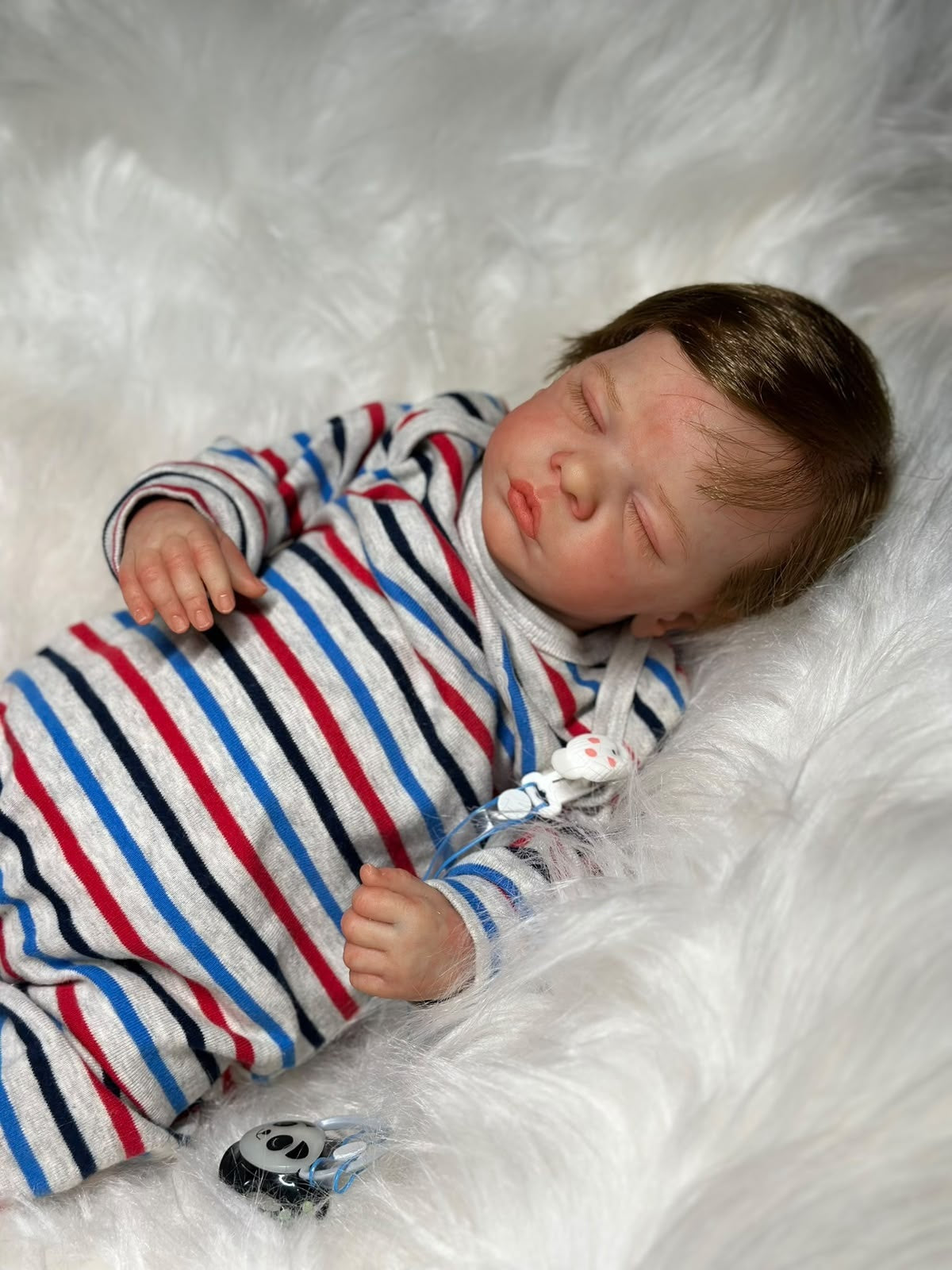 Bebê Reborn Theo — Macacão Listrado
